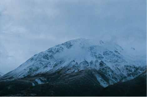 Near evening shot of a snowy mountainside in Alaska.